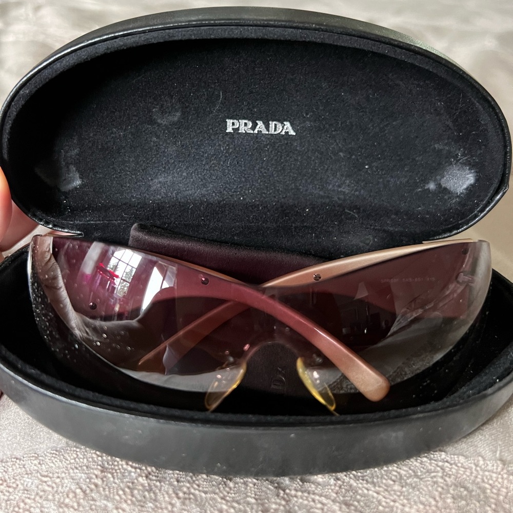 Prada Sunglasses, in a rose color. Haven’t been worn in a really long time.
